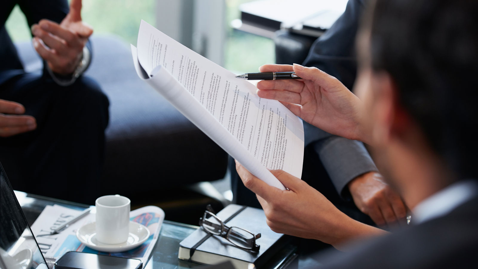 Hands holding a document