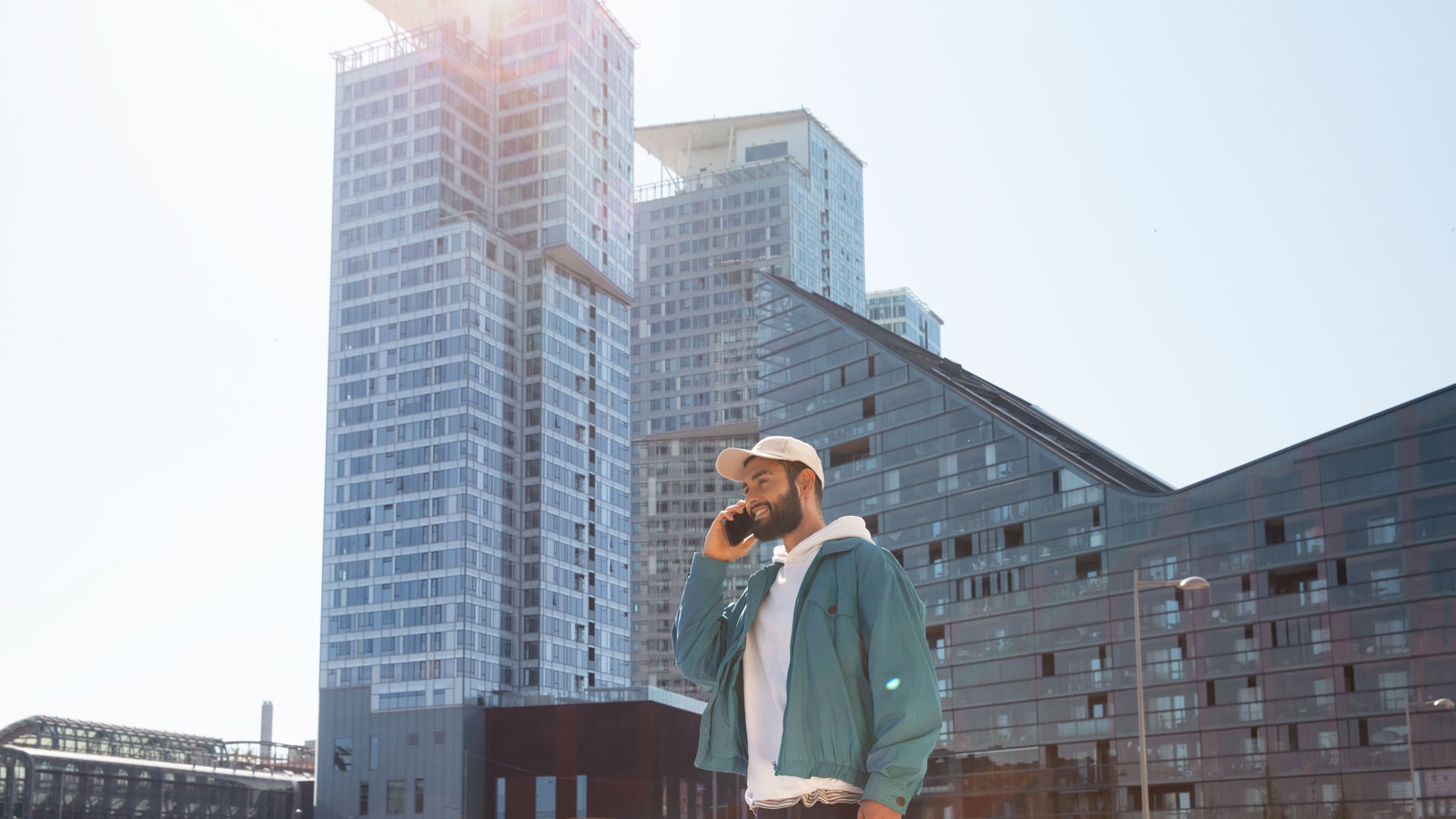 Multiple international flags outside a big office building
